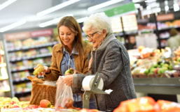 caregiver and senior woman doing grocery